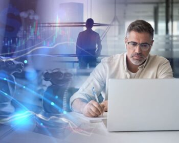 Man working on a laptop with chess pieces, financial graphs, and a silhouette of a person in the background.