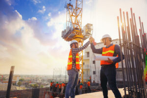 How Viva Capital’s Quick Pay Program is Revolutionizing Subcontractor Financing 1 Architect,And,Engineer,Construction,Workers,Shaking,Hands,While talking about quick pay