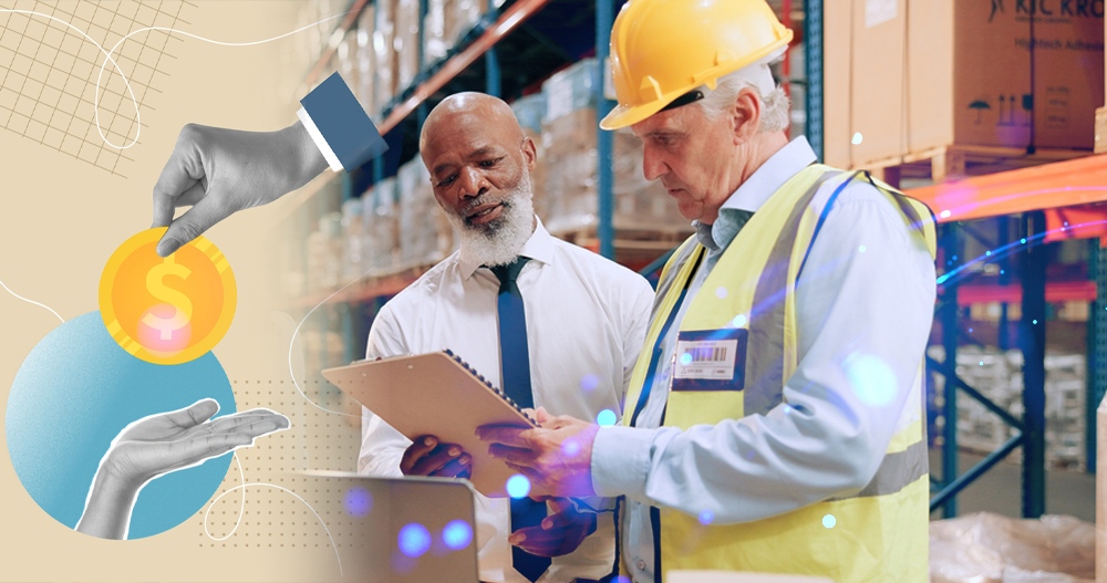 Image of two older gentlemen who are inside a warehouse discussing trade credit terms and if they can come to some agreement. One of them is in office attire and the other is wearing a hardhat and a safety vest.